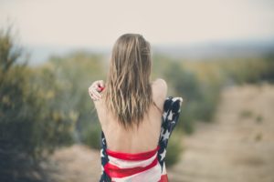 Freedom is an opportunity and responsiblity: woman wrapped in American flag